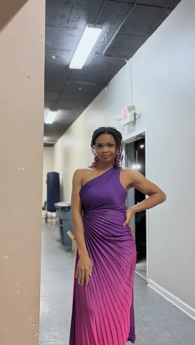 Founder Vanessa of Event Partners in an elegant purple dress